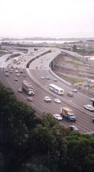 A photo showing the view over a noisy freeway from a condominium.